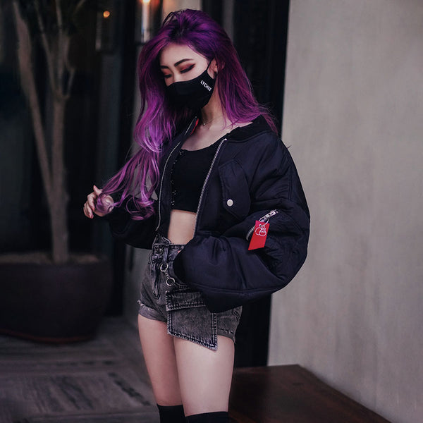 lychee the label streetwear face mask with model rocking an oversized bomber and shorts