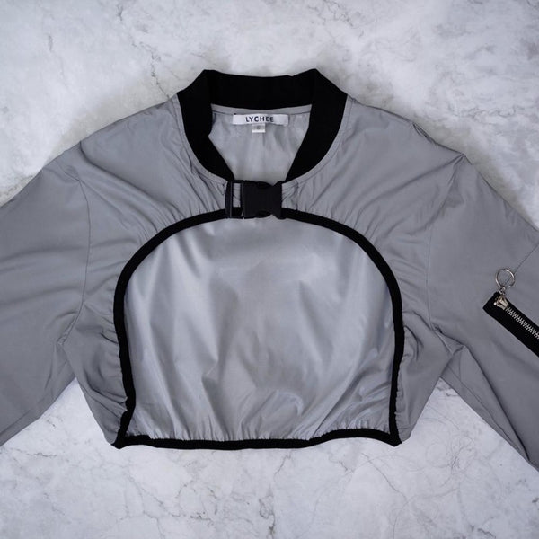 reflective bomber close up flat lay