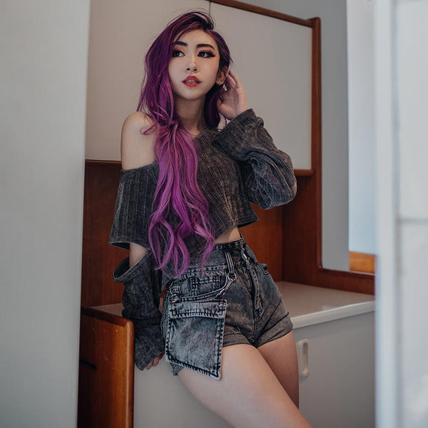 purple hair model wearing oversized pocket denim shorts