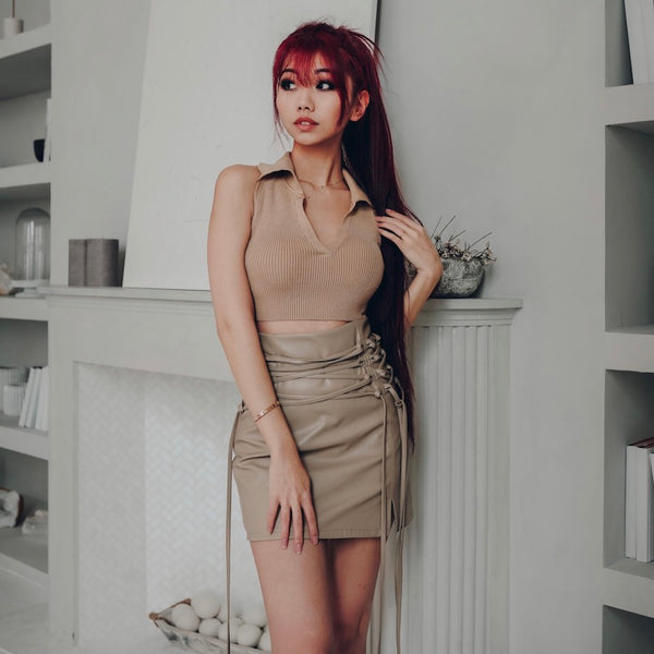 taiyaki lace up skirt and matching beige polo top on red hair model