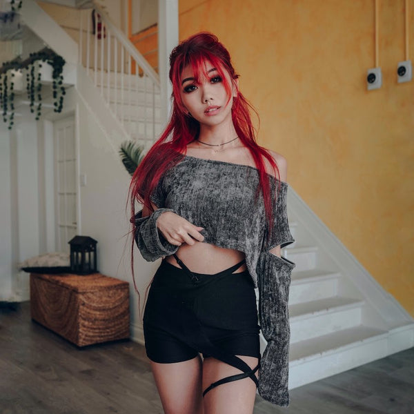 tare strap shorts with velvet off shoulder grey sweater on red hair model