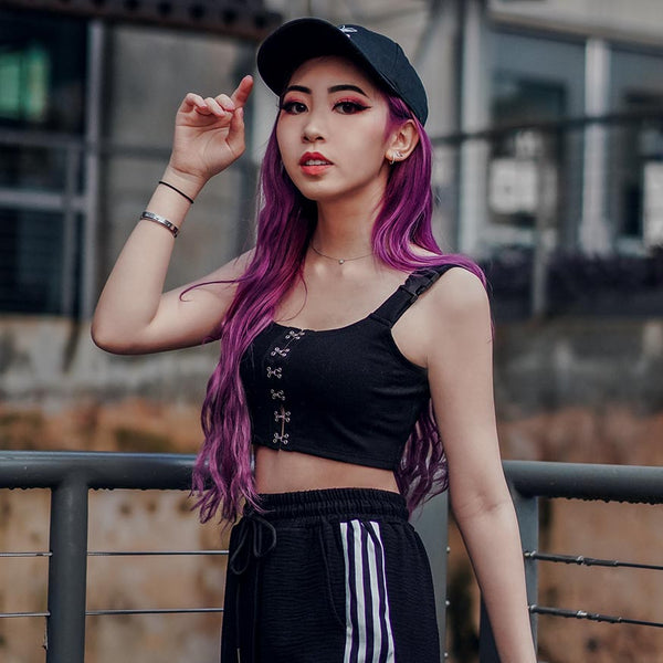 uni buckle crop tank with black joggers on purple hair model in cap