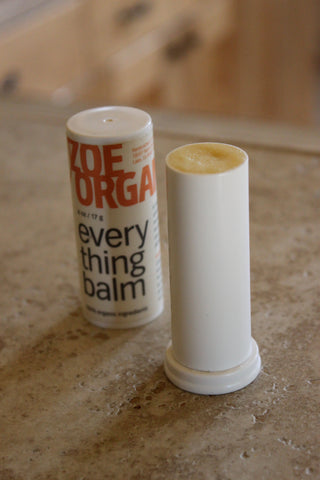 Adjust balm to be flush with the top rim of the balm tube. Place cap on tight.