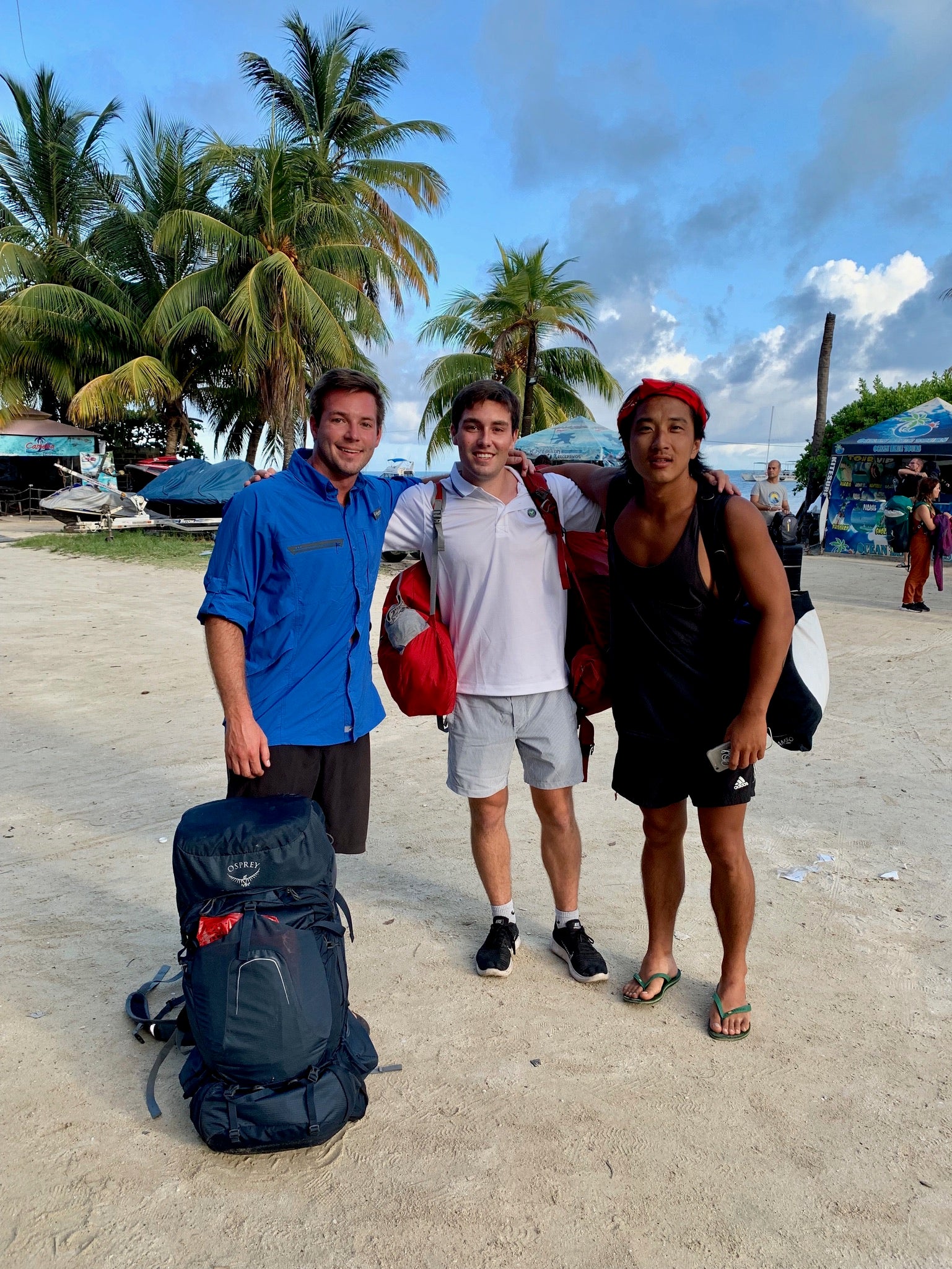 Footy Intl co-founder Drew with friend Kyle and their scuba diving instructor