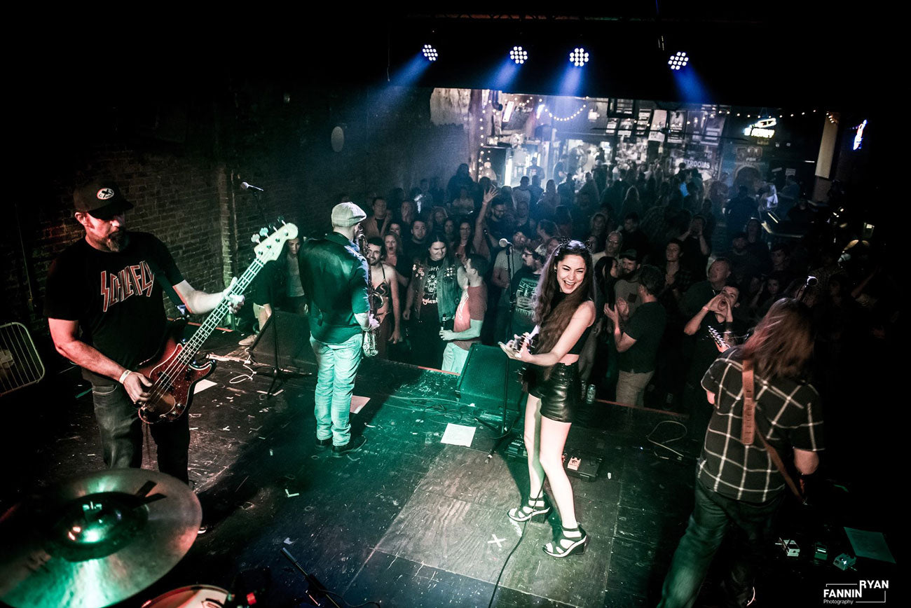 Rock band on stage with crowd