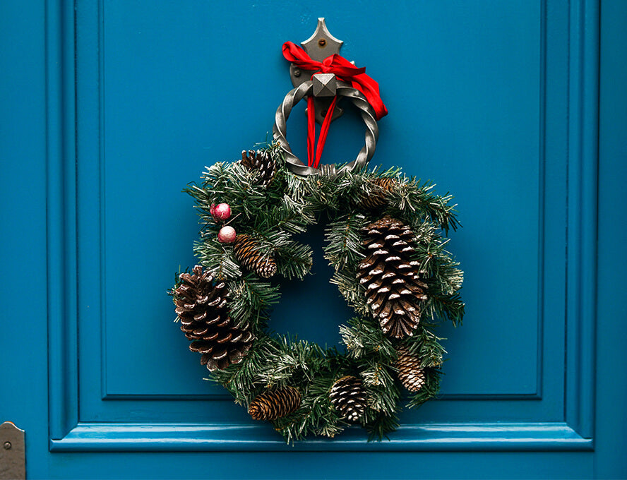 Christmas wreath made from natural materials hanging ona front door