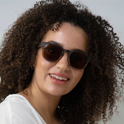 Sustainable sunglasses modelled by a woman