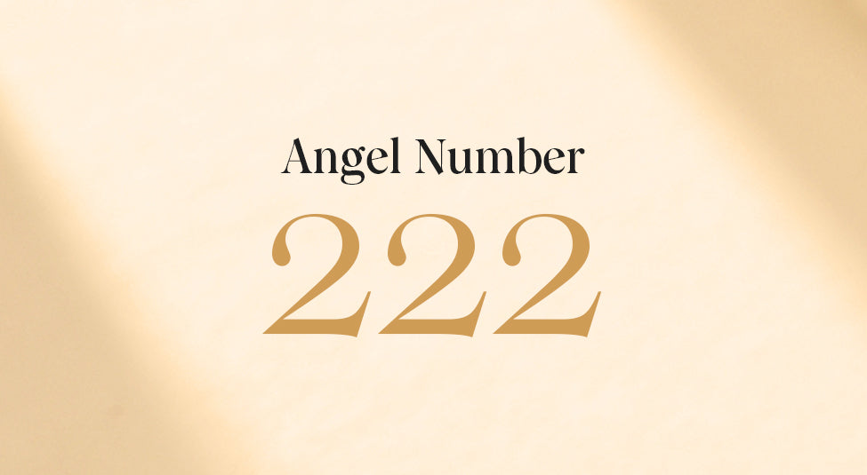 angel number 222 on a gold background