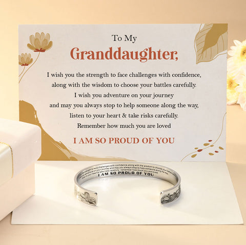 To My Granddaughter, I Am So Proud of You Bracelet on top of a heartfelt note