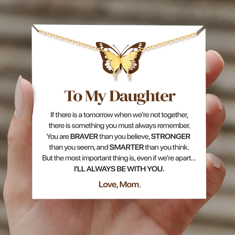 model holding To My Daughter, I’ll Always Be With You Butterfly Necklace with a personalized message card