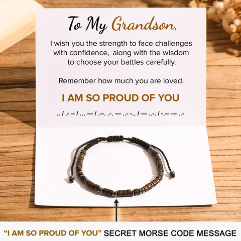 To My Grandson, I Am So Proud of You Morse Code Bracelet on top of a folded note