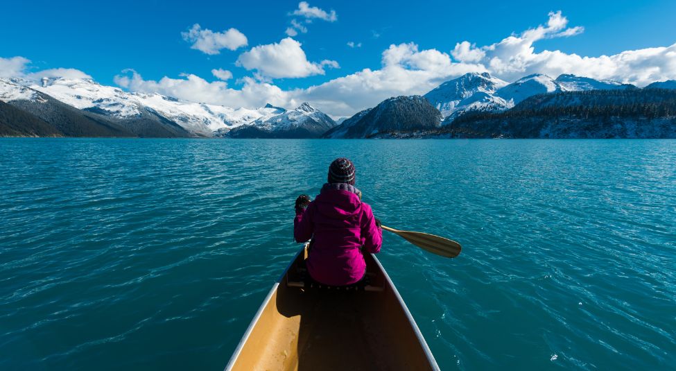 A woman on a kayak in the lake