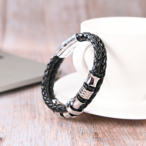 Bracelet placed beside an empty coffee cup