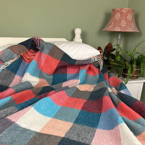 merino wool bnaket on a bed