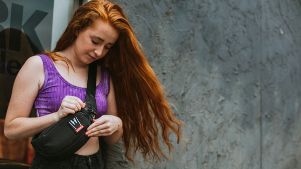 Girl with red hair wearing Dime Bags Outfit smell-proof fanny pack