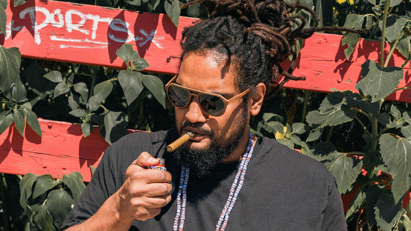 Artist Vincent Gordon lighting a blunt