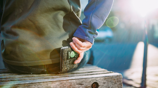 Dime Bags wallet being put into bag