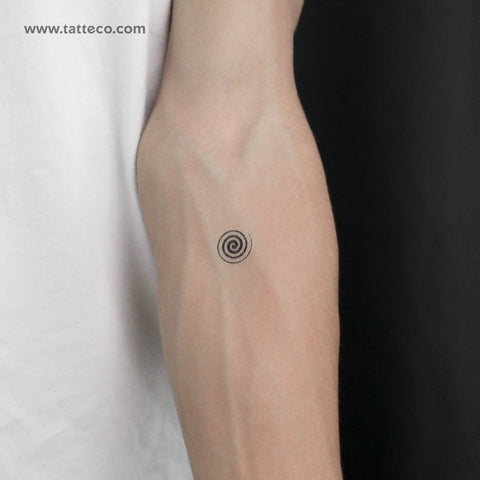 Dotwork spiral tattoo on the inner forearm.