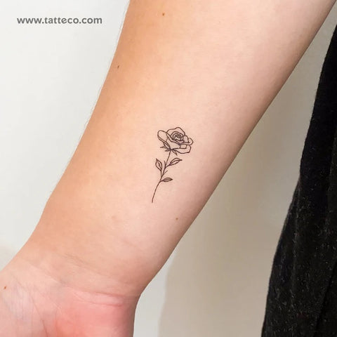 Aphrodite Tattoo: A fine line outline of a rose tattoo