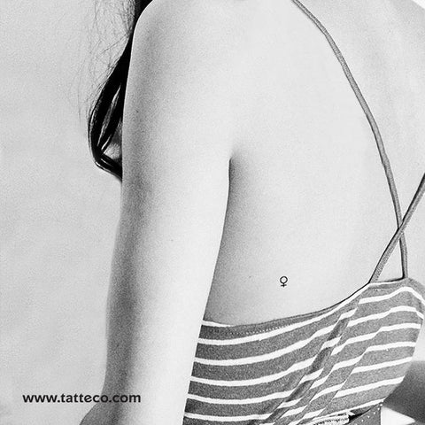 Aphrodite Tattoo: a small, fine line venus planet symbol