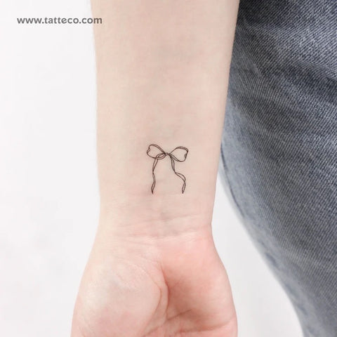 Bow tattoos: fine line ribbon bow tattoo