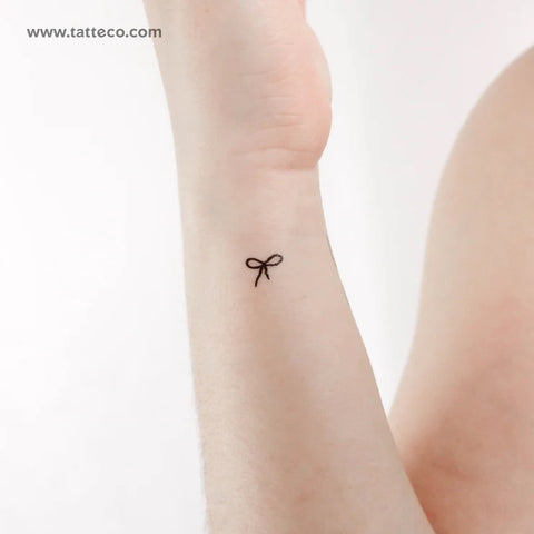Bow tattoos: Hailey Bieber inspired tiny bow tattoo