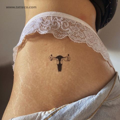 Emba: Uterus moon tattoo