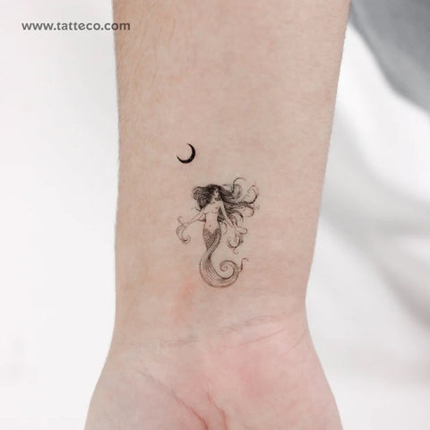 Female figure tattoo: fine line mermaid and crescent moon tattoo on the wrist