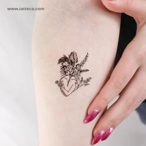 Female figure tattoo: Woman torso tattoo with foliage