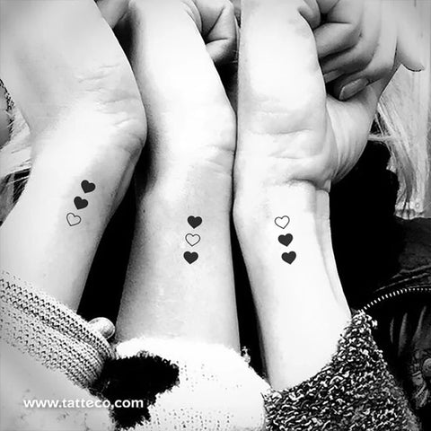 Matching sister tattoos: Three vertical heart matching tattoos