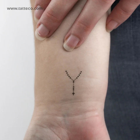 Minimalist Christian Tattoos: Rosary finger tattoo