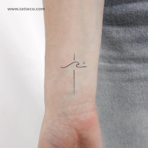 Minimalist Christian Tattoos: Wave and cross fine line tattoo