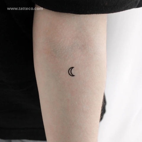 Moon phase tattoo: Crescent moon tattoo on an arm