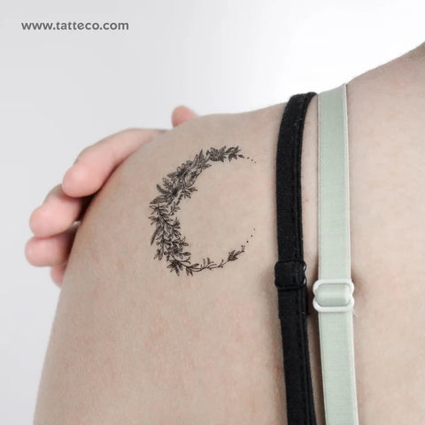 Moon phase tattoo: A detailed fine line flower crescent moon tattoo
