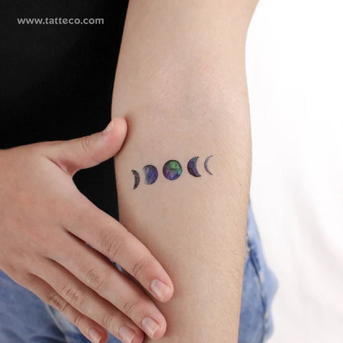 Moon phase tattoo: colorful watercolor moon phase tattoo on the arm