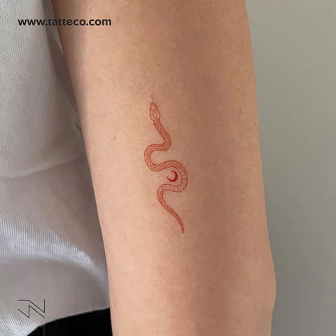 Nature tattoos: Red ink soma snake tattoo with crescent moon