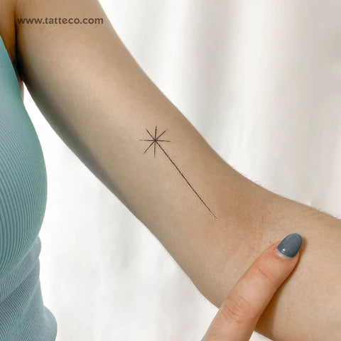 Shooting star tattoos: black minimal fine line shooting star tattoo