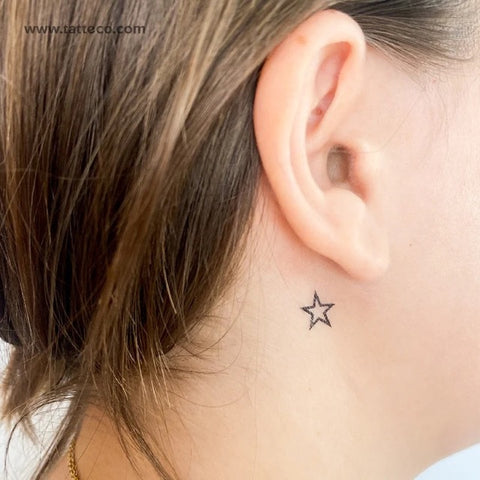 Shooting Star Tattoos: Star outline tattoo behind the ear