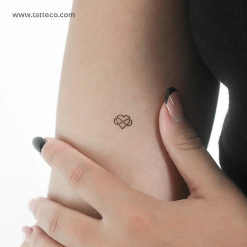 Wedding tattoos: Tiny intertwined heart fine line tattoo