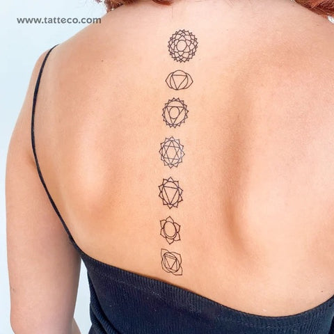 Yoga Tattoos: Line of Chakra tattoos on the spine