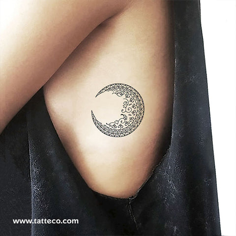 crescent moon with face tattoo
