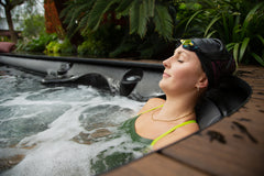 Woman in hot tub with swim cap