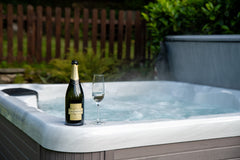 Hot tub with champagne bottle on