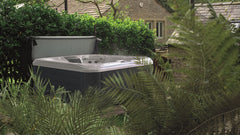 Hot tub surrounded by ferns