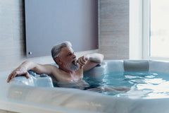 Man relaxing in a swim spa