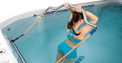 Woman exercising in a swim spa