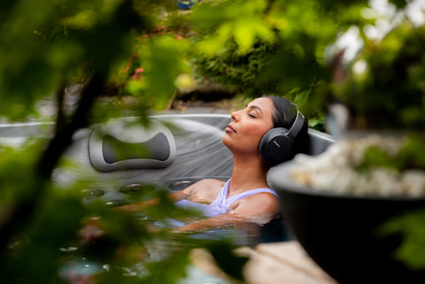 Relaxing in hot tub with headphones