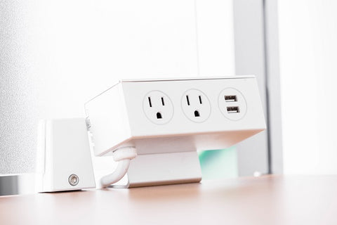 Photo of an electric socket is built in the computer desk