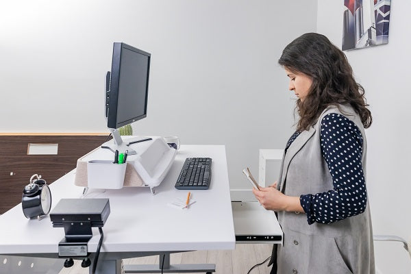 Woman at a standing desk