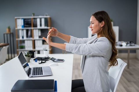 Photo of a young woman doing exercise for arms  